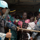 United Nations peacekeepers corral South Sudanese women and children before the distribution of emergency food supplies at a POC site in Juba.